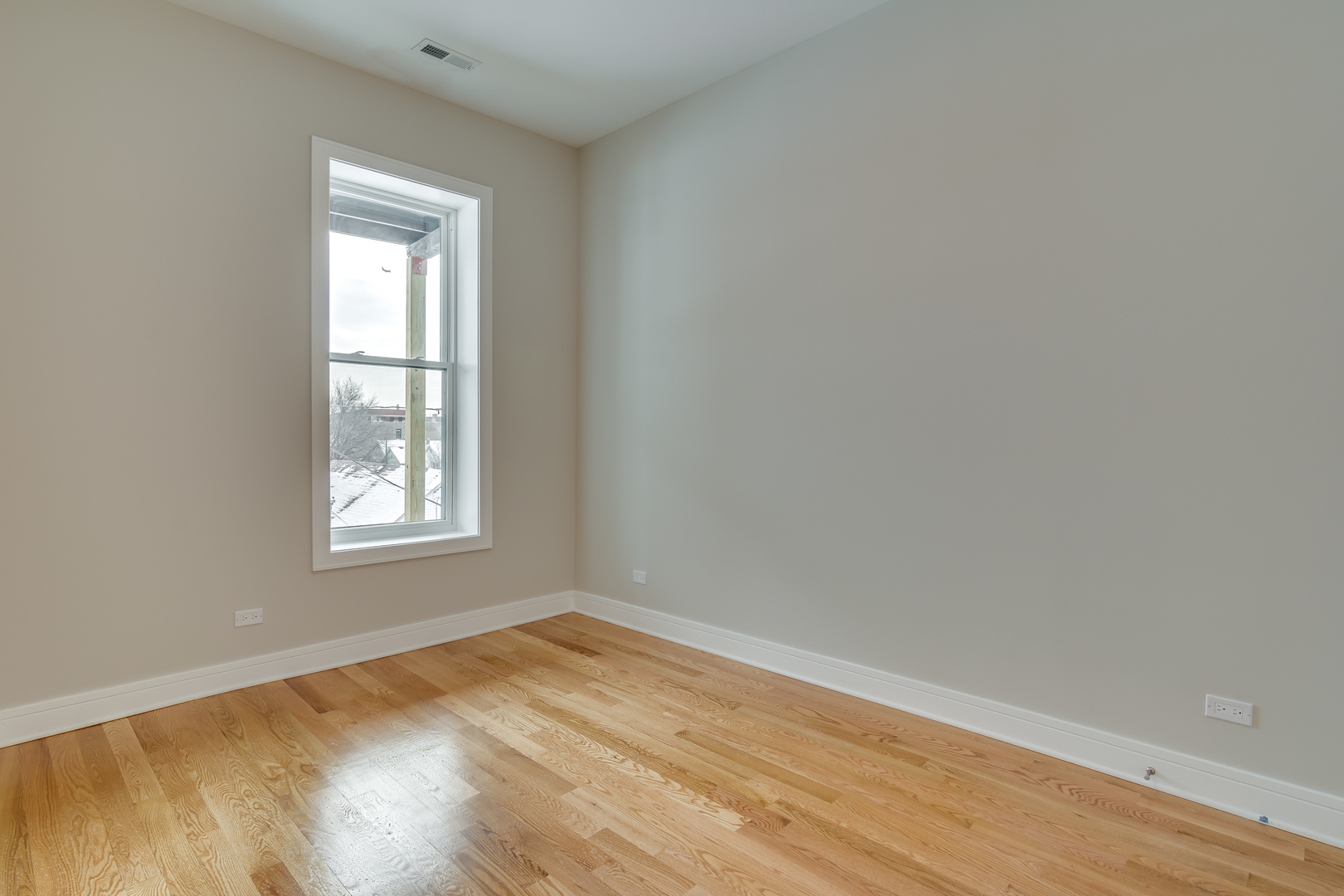 965 West 18th Street Chicago, IL 60608 - Photo 39 of 46 an empty room with wooden floor and windows