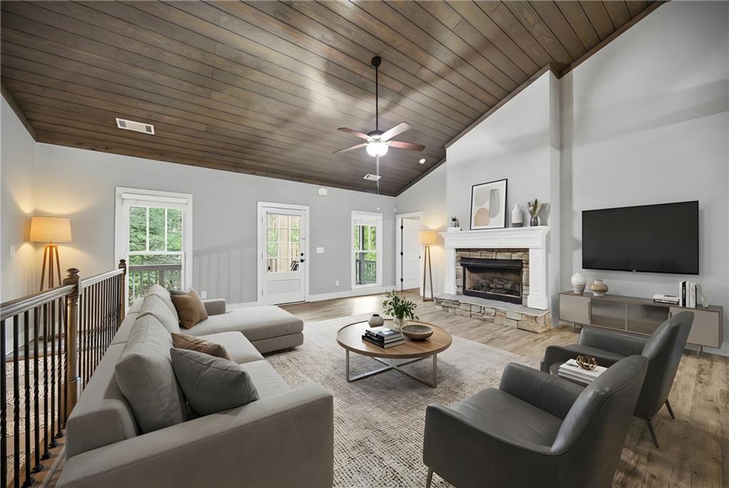 294 Town Creek Road Talking Rock, GA 30175 - Photo 11 of 68 a living room with furniture a fireplace and a flat screen tv