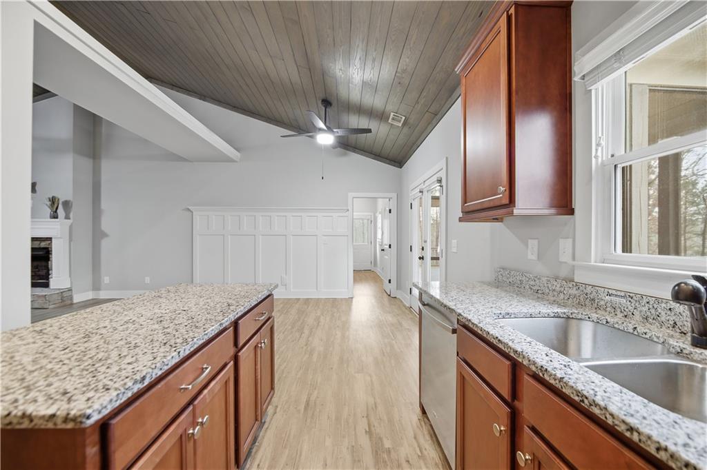 294 Town Creek Road Talking Rock, GA 30175 - Photo 17 of 68 a kitchen with stainless steel appliances granite countertop a sink stove and refrigerator