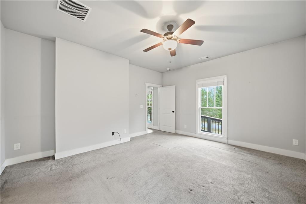 294 Town Creek Road Talking Rock, GA 30175 - Photo 19 of 68 an empty room with windows and fan