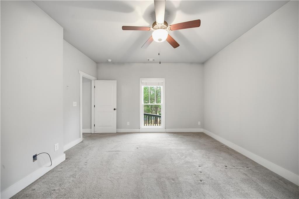 294 Town Creek Road Talking Rock, GA 30175 - Photo 20 of 68 an empty room with windows and fan
