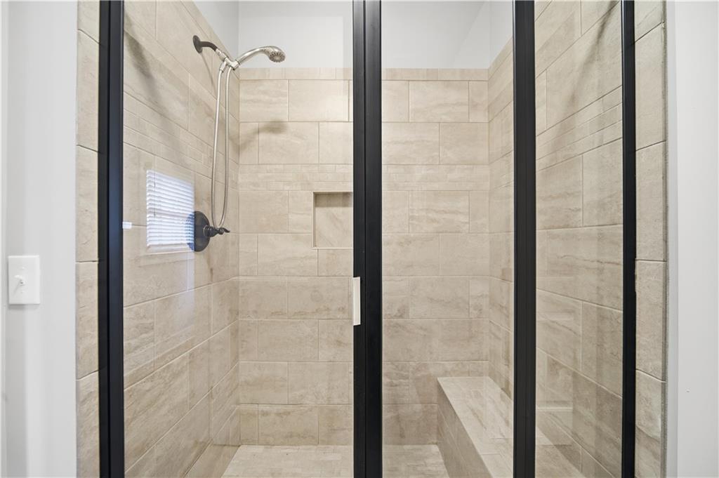294 Town Creek Road Talking Rock, GA 30175 - Photo 27 of 68 a bathroom with a glass shower door