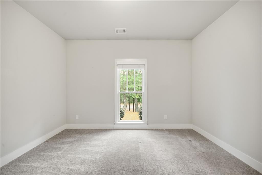 294 Town Creek Road Talking Rock, GA 30175 - Photo 29 of 68 an empty room with a window