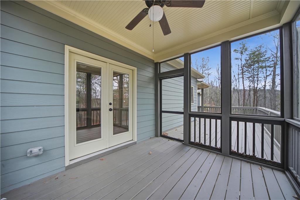 294 Town Creek Road Talking Rock, GA 30175 - Photo 34 of 68 a view of a porch with wooden floor and a floor to ceiling window