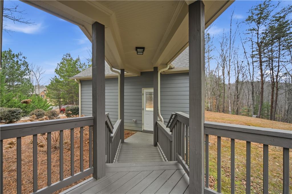 294 Town Creek Road Talking Rock, GA 30175 - Photo 37 of 68 a view of a balcony with furniture and floor to ceiling window