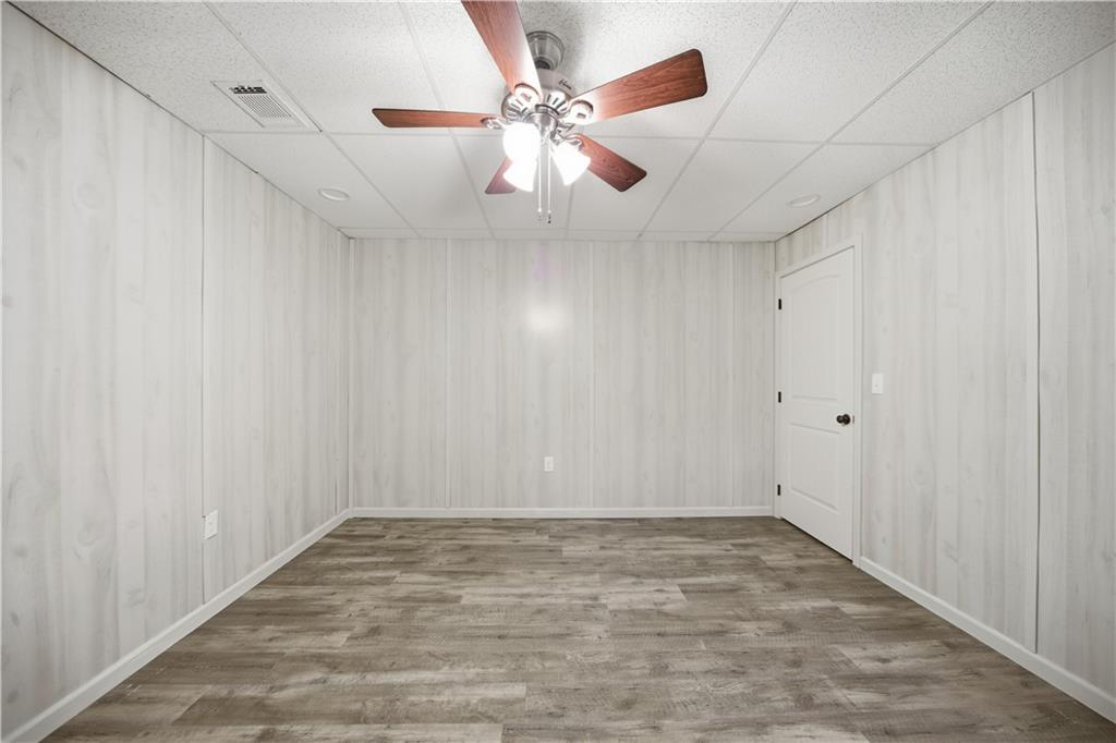 294 Town Creek Road Talking Rock, GA 30175 - Photo 38 of 68 an empty room with ceiling fan and window