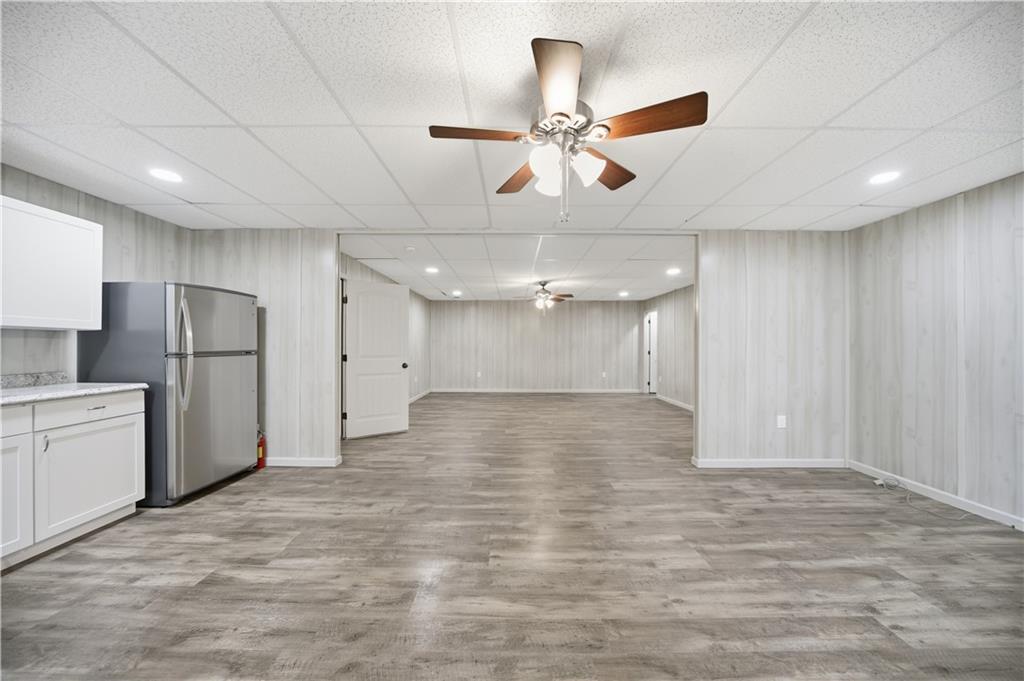 294 Town Creek Road Talking Rock, GA 30175 - Photo 46 of 68 a view of a kitchen with a refrigerator and a ceiling fan