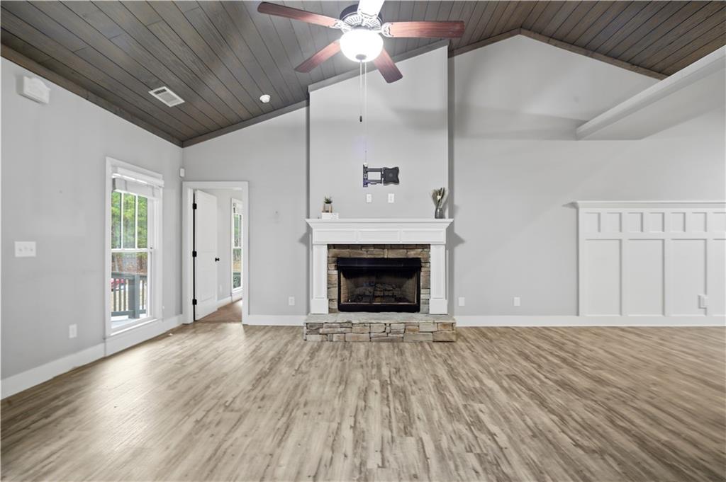 294 Town Creek Road Talking Rock, GA 30175 - Photo 8 of 68 wooden floor fireplace and natural light in room