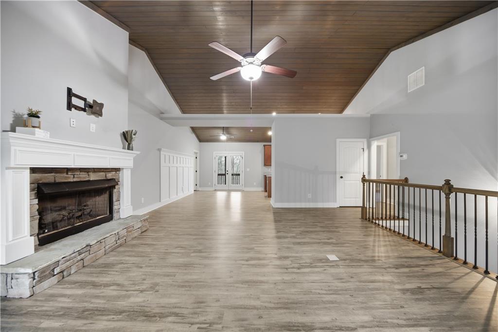 294 Town Creek Road Talking Rock, GA 30175 - Photo 9 of 68 a view of empty room with wooden floor and fireplace