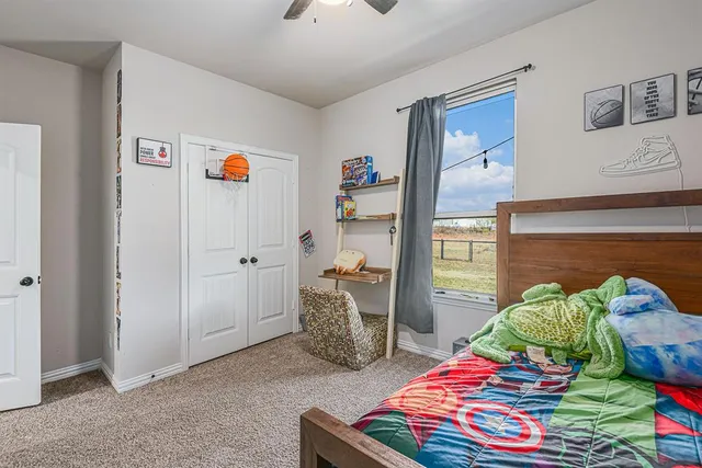 a room with two washing machines with rug