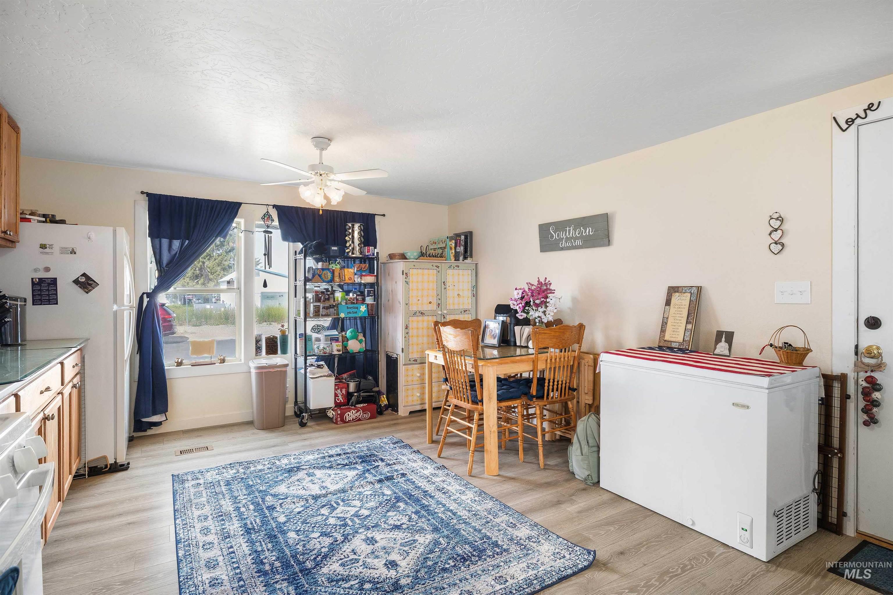198 South Hills Road, Unit 116 Twin Falls, ID 83301 - Photo 7 of 21 Dining space featuring a ceiling fan and light wood-type flooring