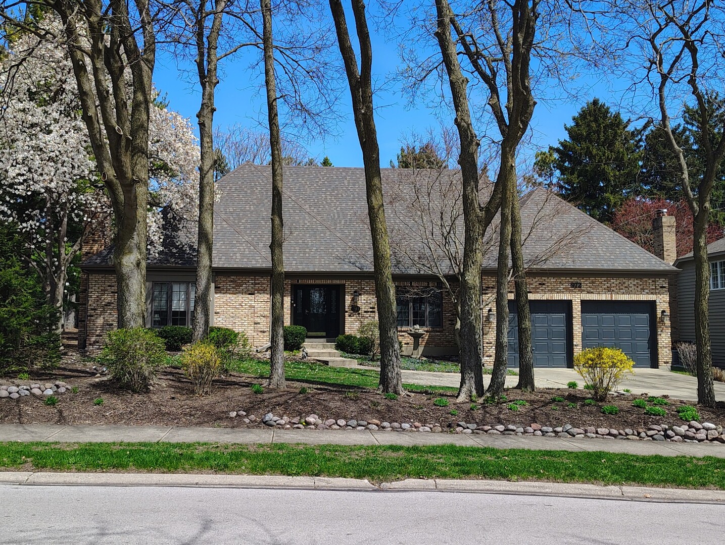 a front view of a house with garden