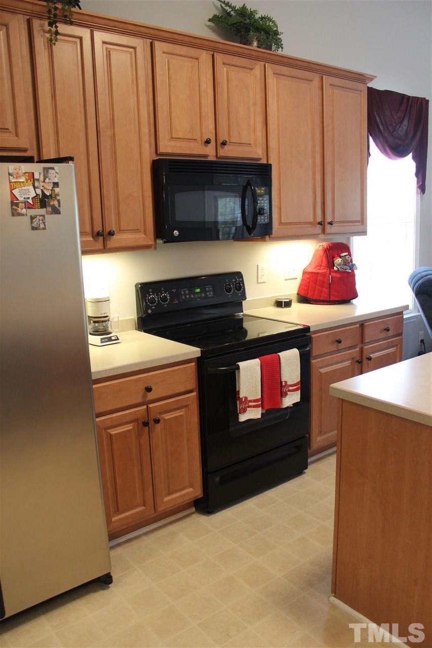 10306 Dapping Drive Raleigh, NC 27614 - Photo 6 of 25 Kitchen boast tons of storage, SS fridge and an island!