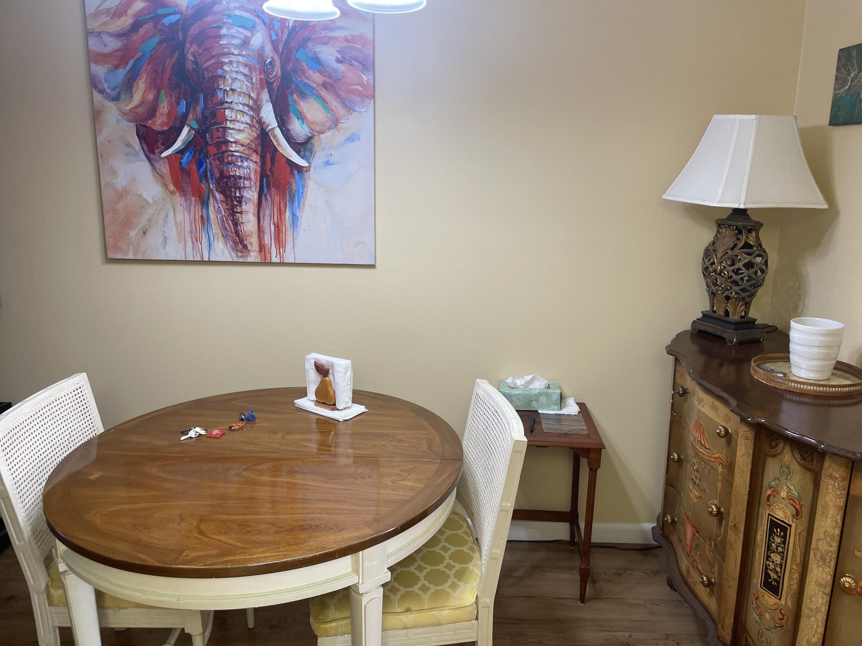 183 Dorchester East, Unit H West Palm Beach, FL 33417 - Photo 11 of 28 a workspace with furniture and wooden floor