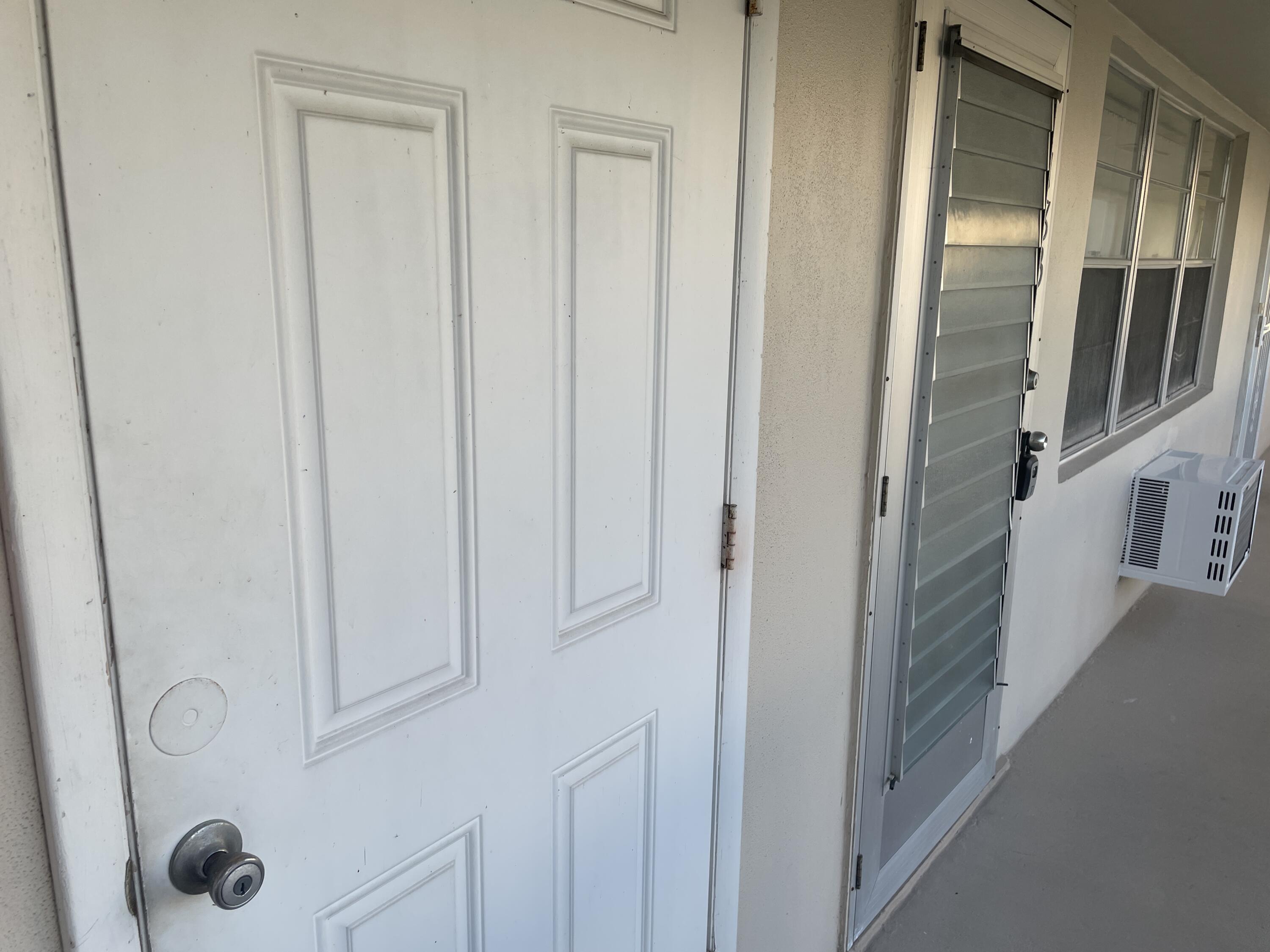 183 Dorchester East, Unit H West Palm Beach, FL 33417 - Photo 2 of 28 a bathroom with a shower