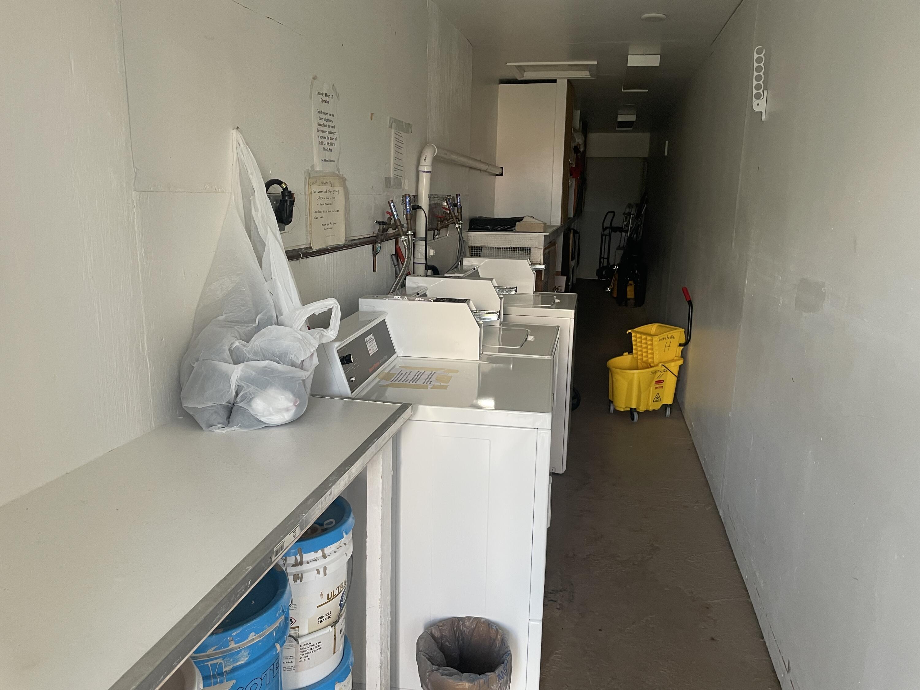 183 Dorchester East, Unit H West Palm Beach, FL 33417 - Photo 23 of 28 a utility room with dryer and washer