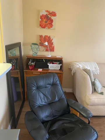 a living room with a flat screen tv and furniture