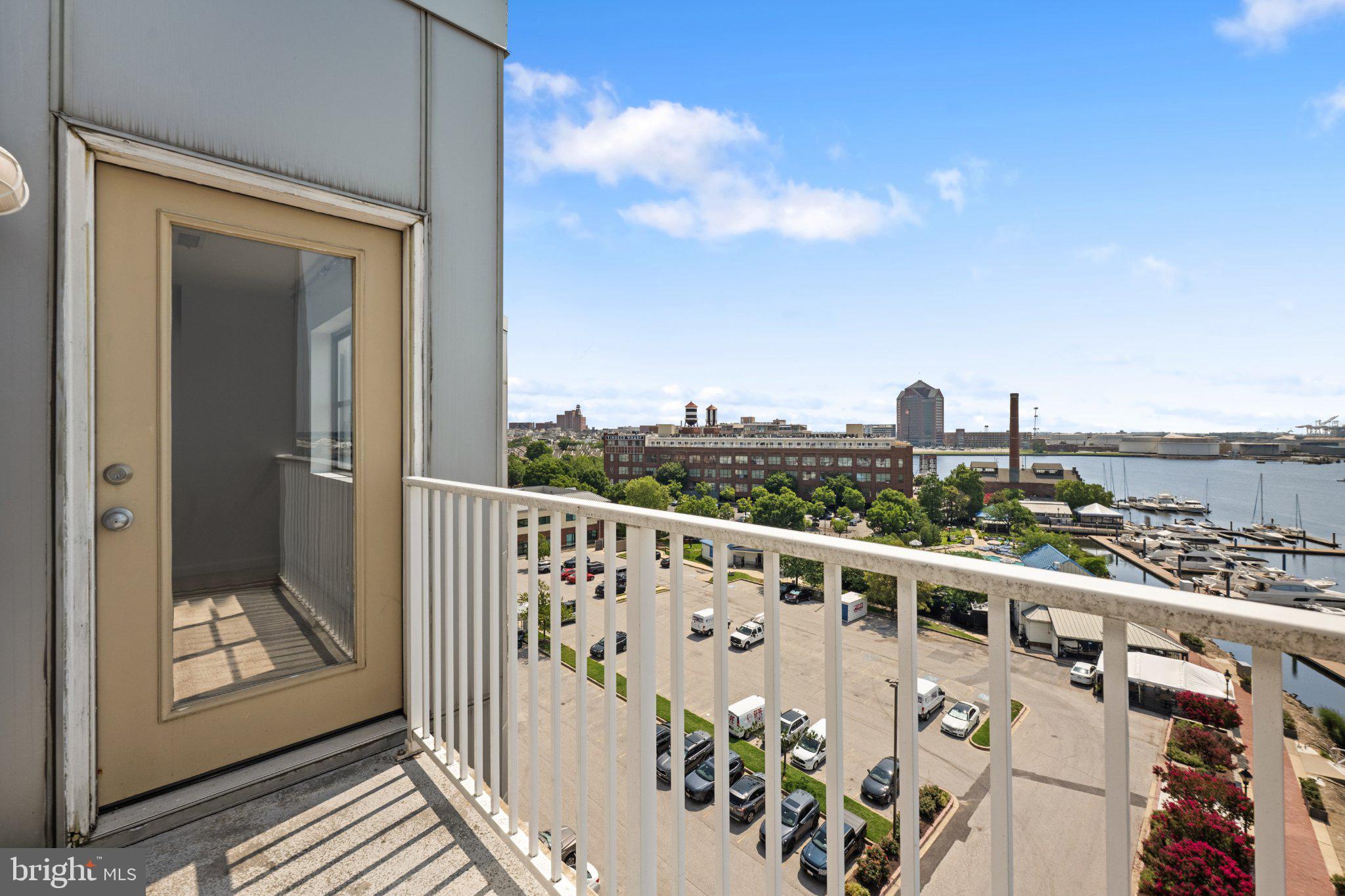 2702 Lighthouse Point East, Unit 738 Baltimore, MD 21224 - Photo 32 of 33 Scenic balcony with waterfront views.
