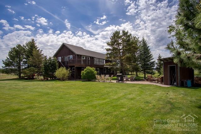 22522 Rickard Road Bend, OR 97702 - Photo 19 of 23 a view of a house with a yard and sitting area