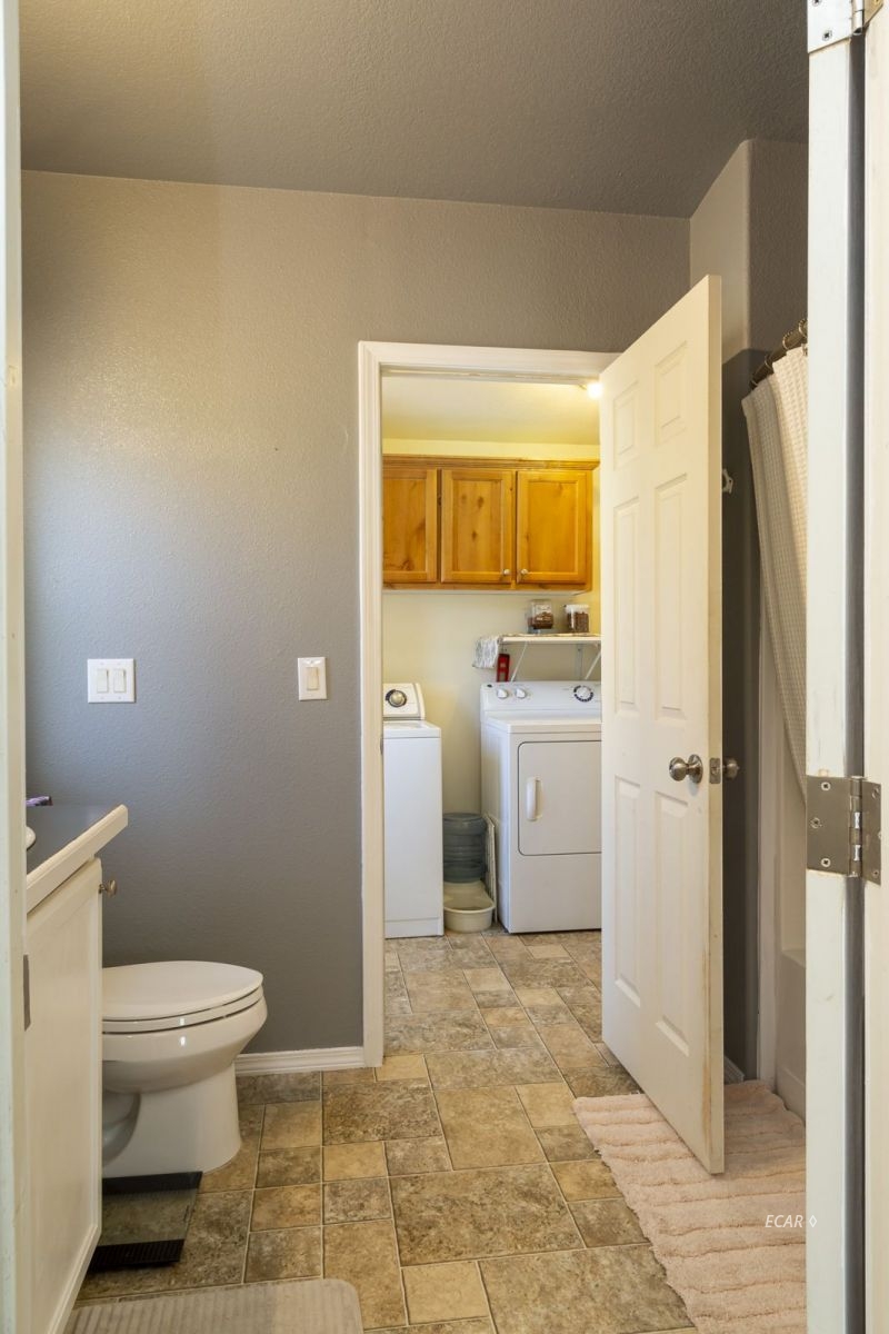 426 Spring Valley Parkway Spring Creek, NV 89815 - Photo 11 of 16 a bathroom with a toilet and a shower