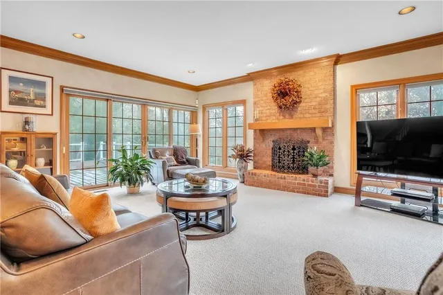 a living room with furniture tv and a flat screen tv