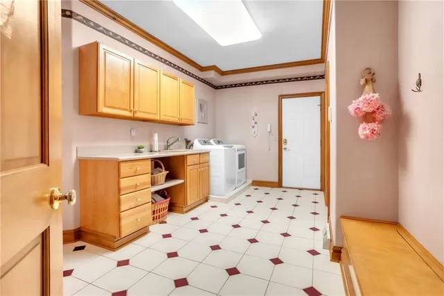 a hallway with cabinets and wooden floor