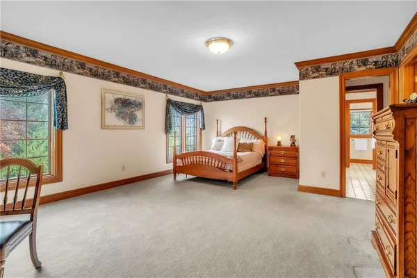 a view of a livingroom with furniture and staircase