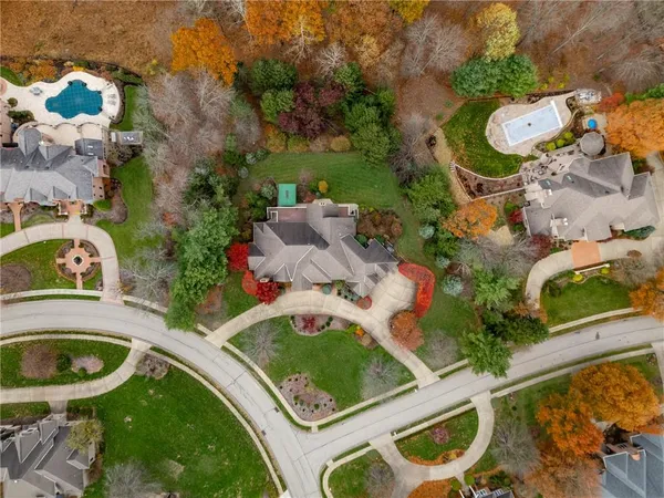 an aerial view of residential house with outdoor space and swimming pool
