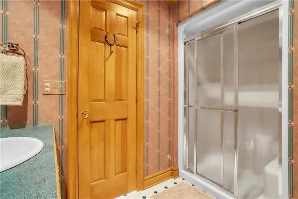 a bathroom with a tub and shower