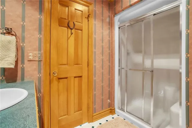 a bathroom with a tub and shower