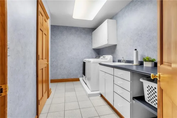a kitchen with a sink a stove and cabinets