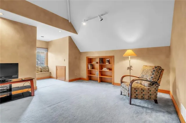 a view of a livingroom with furniture and a ceiling fan