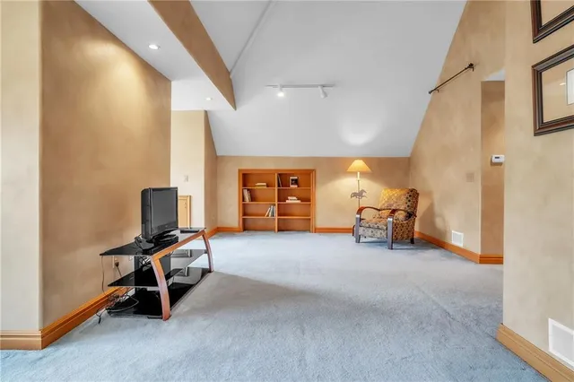 a view of a livingroom with workspace and a window