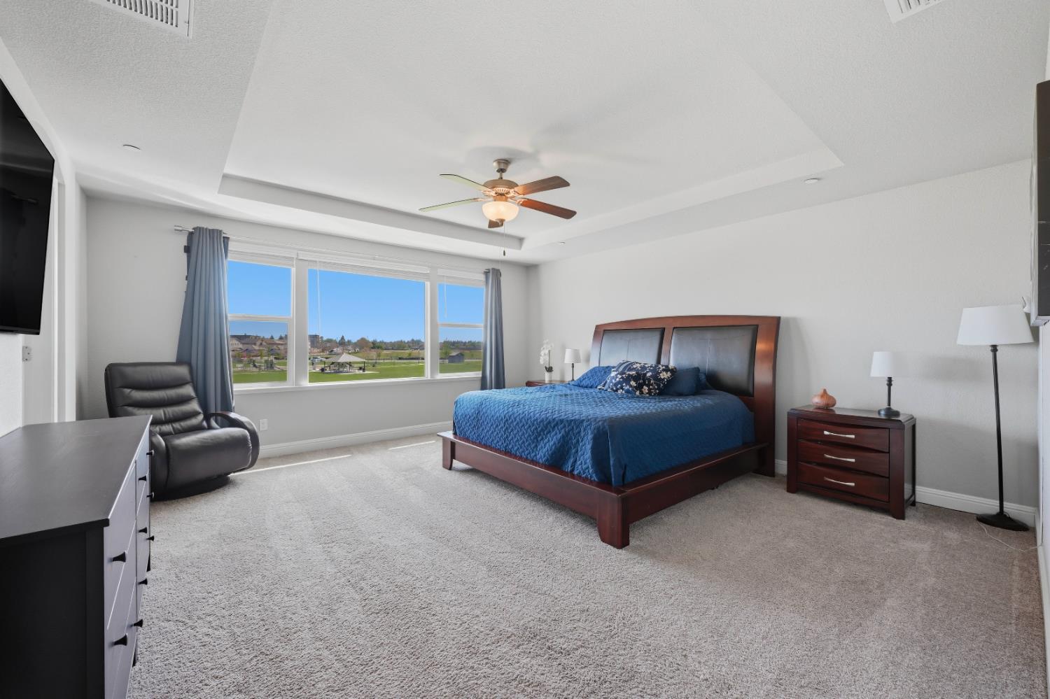 2012 Van Ruiten Drive Lodi, CA 95242 - Photo 25 of 49 a bedroom with a bed and a couch