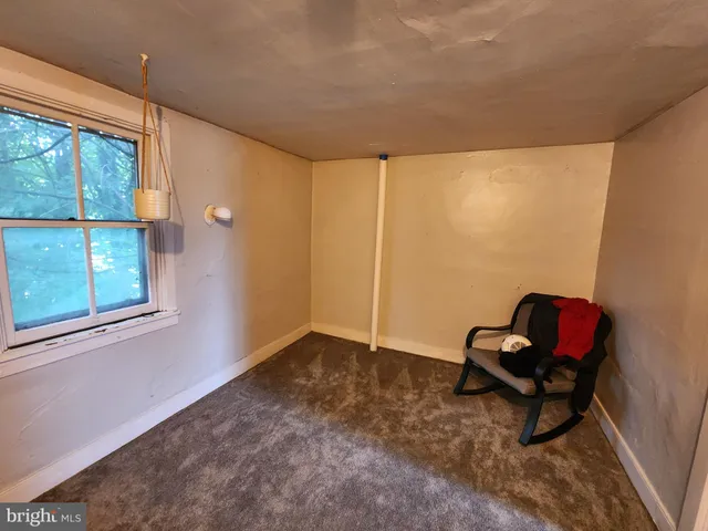 a view of a house with a tree