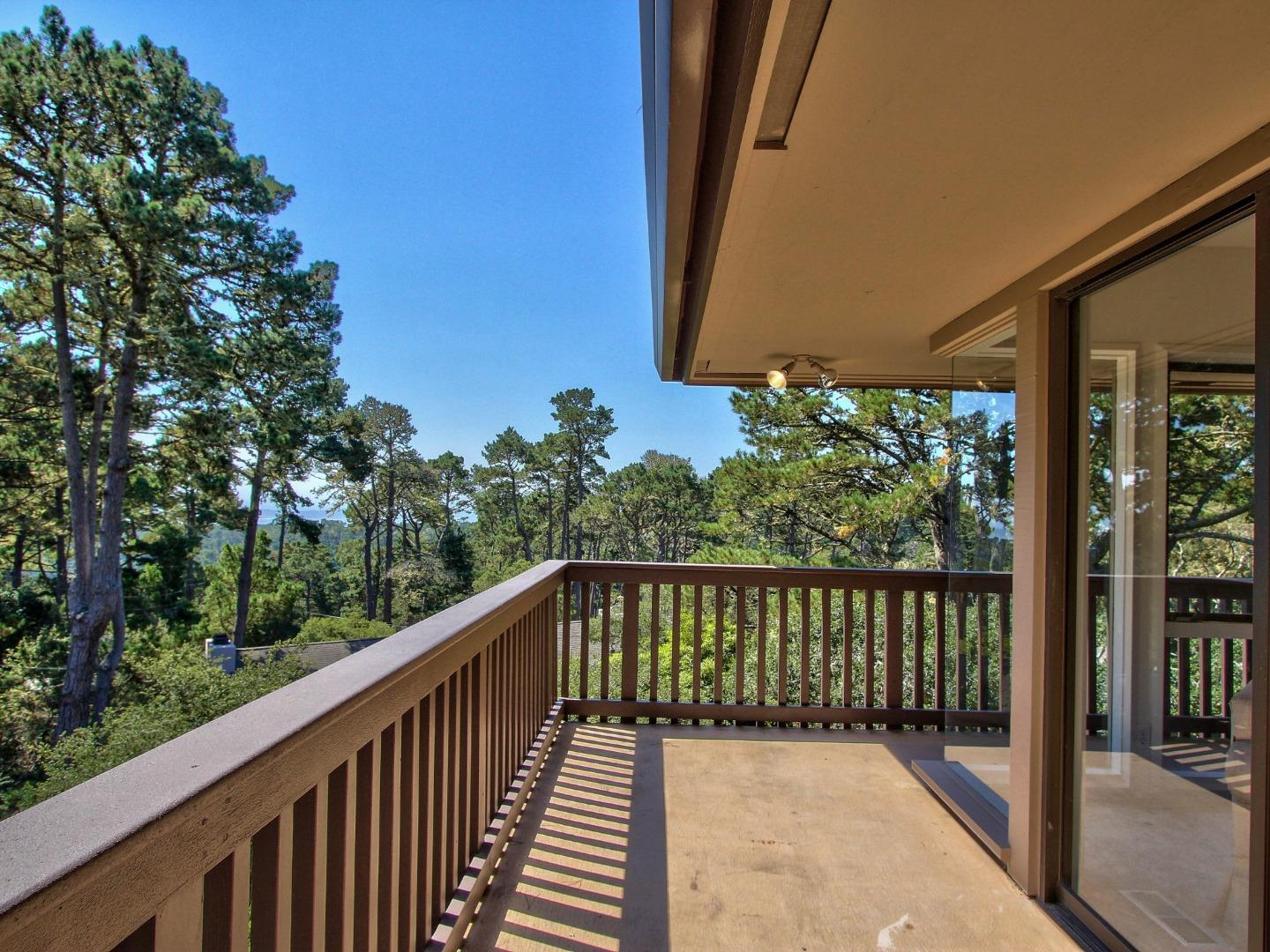 4130 Sunridge Road Pebble Beach, CA 93953 - Photo 23 of 31 a balcony with wooden floor in front of it