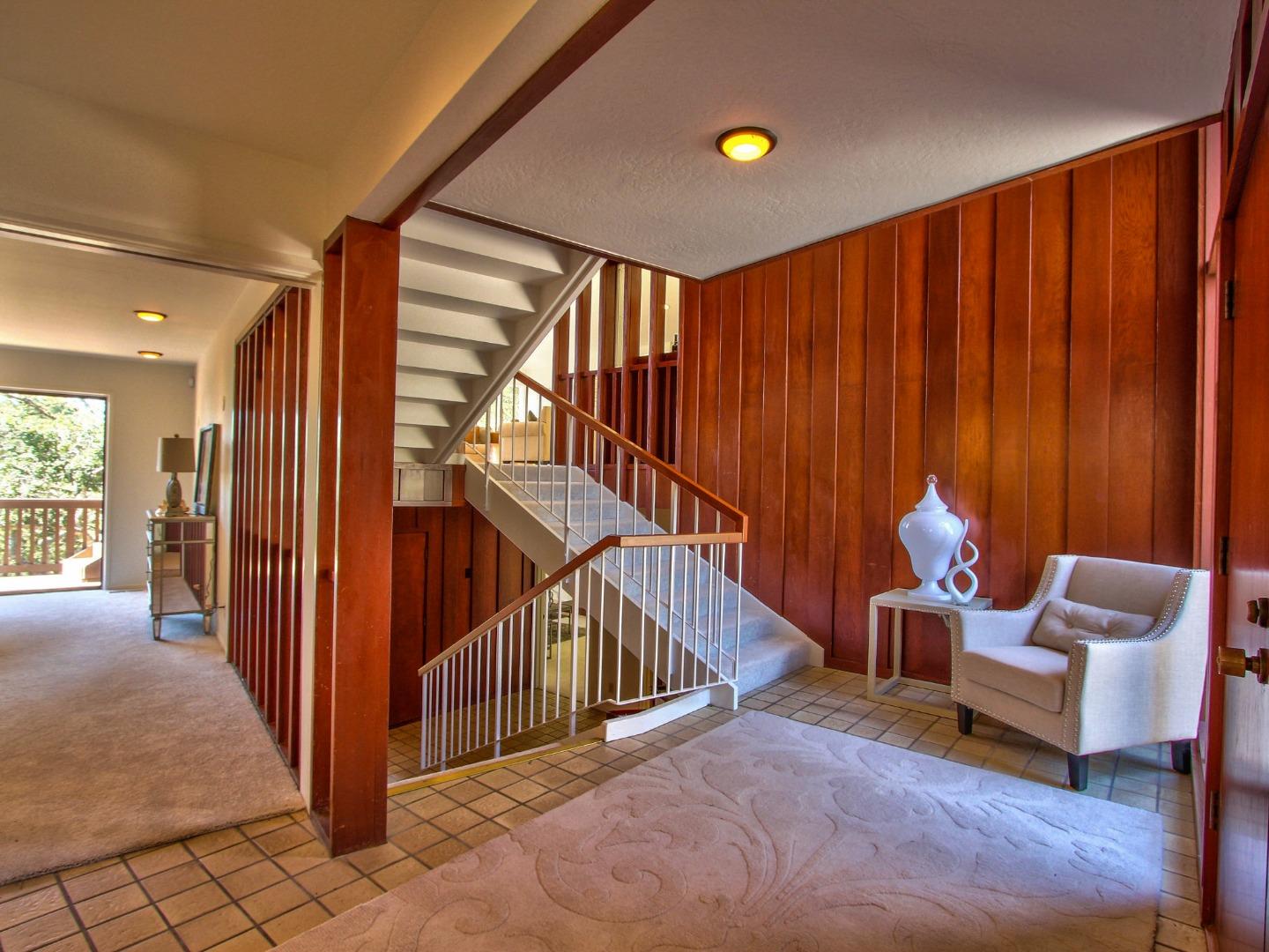 4130 Sunridge Road Pebble Beach, CA 93953 - Photo 3 of 31 a view of a hallway with furniture and stairs