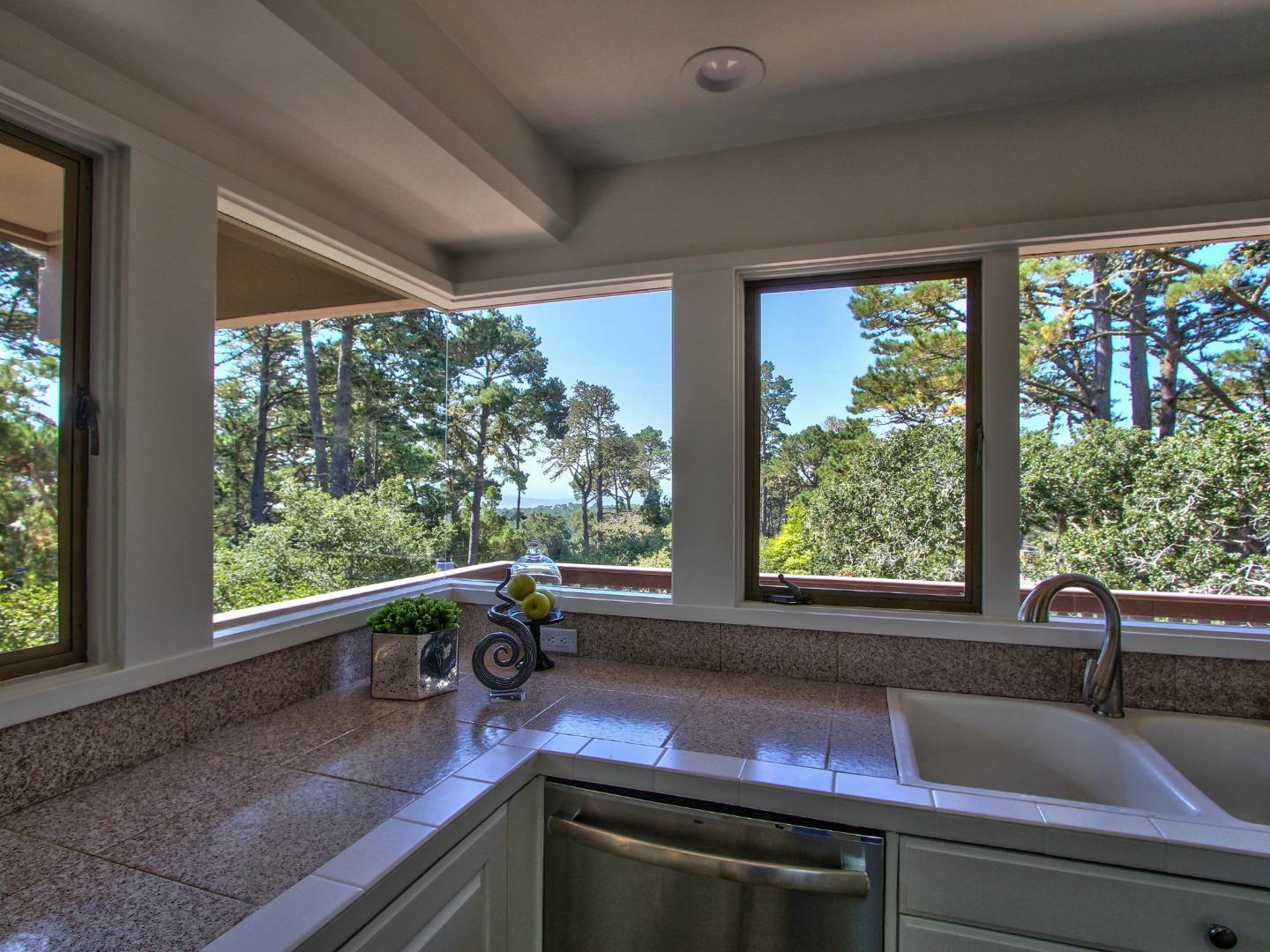 4130 Sunridge Road Pebble Beach, CA 93953 - Photo 7 of 31 a kitchen with a sink and a large window