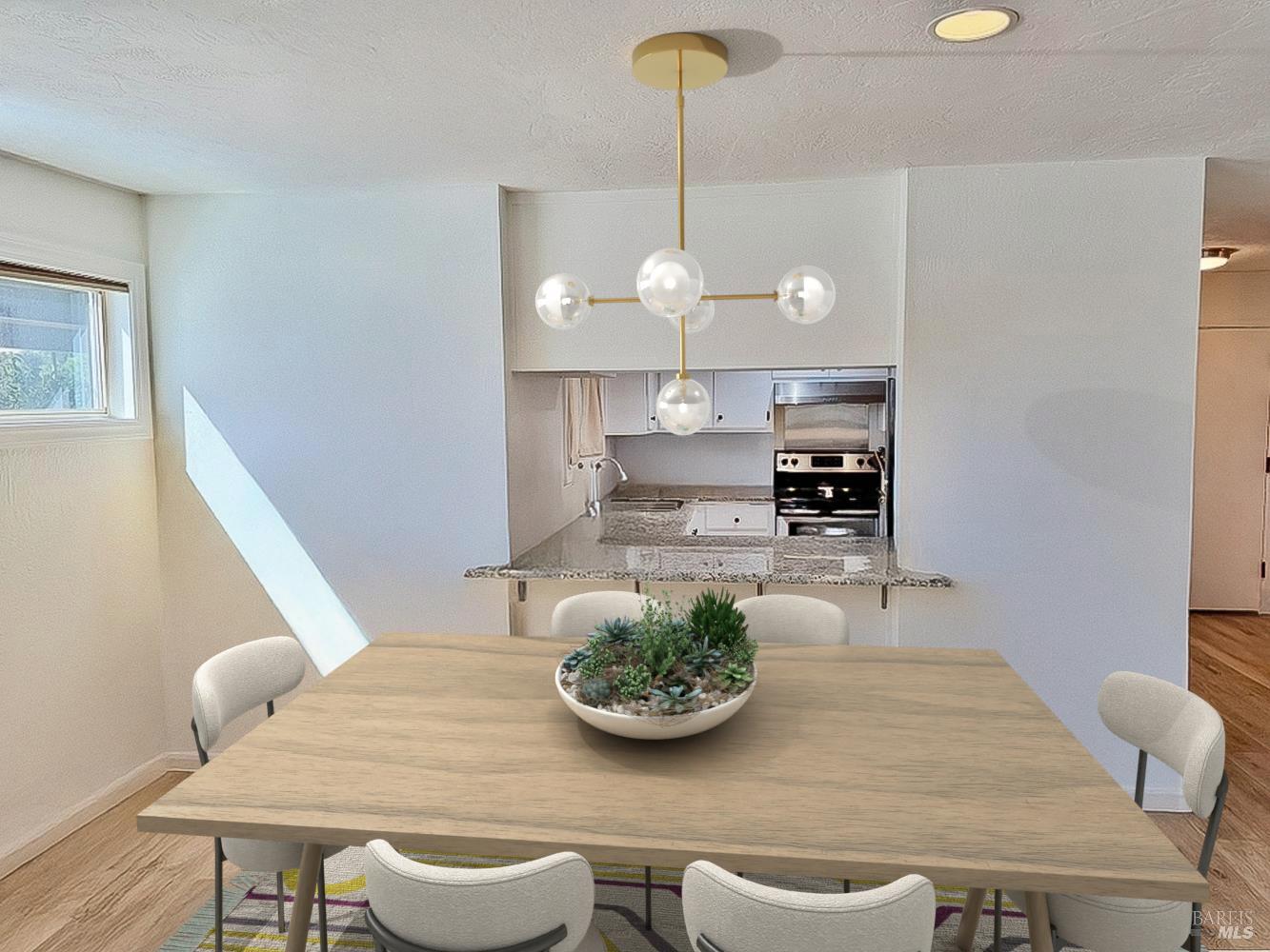 50 Vía Belardo, Unit 12 Greenbrae, CA 94904 - Photo 6 of 13 a view of a dining room with furniture a chandelier and wooden floor
