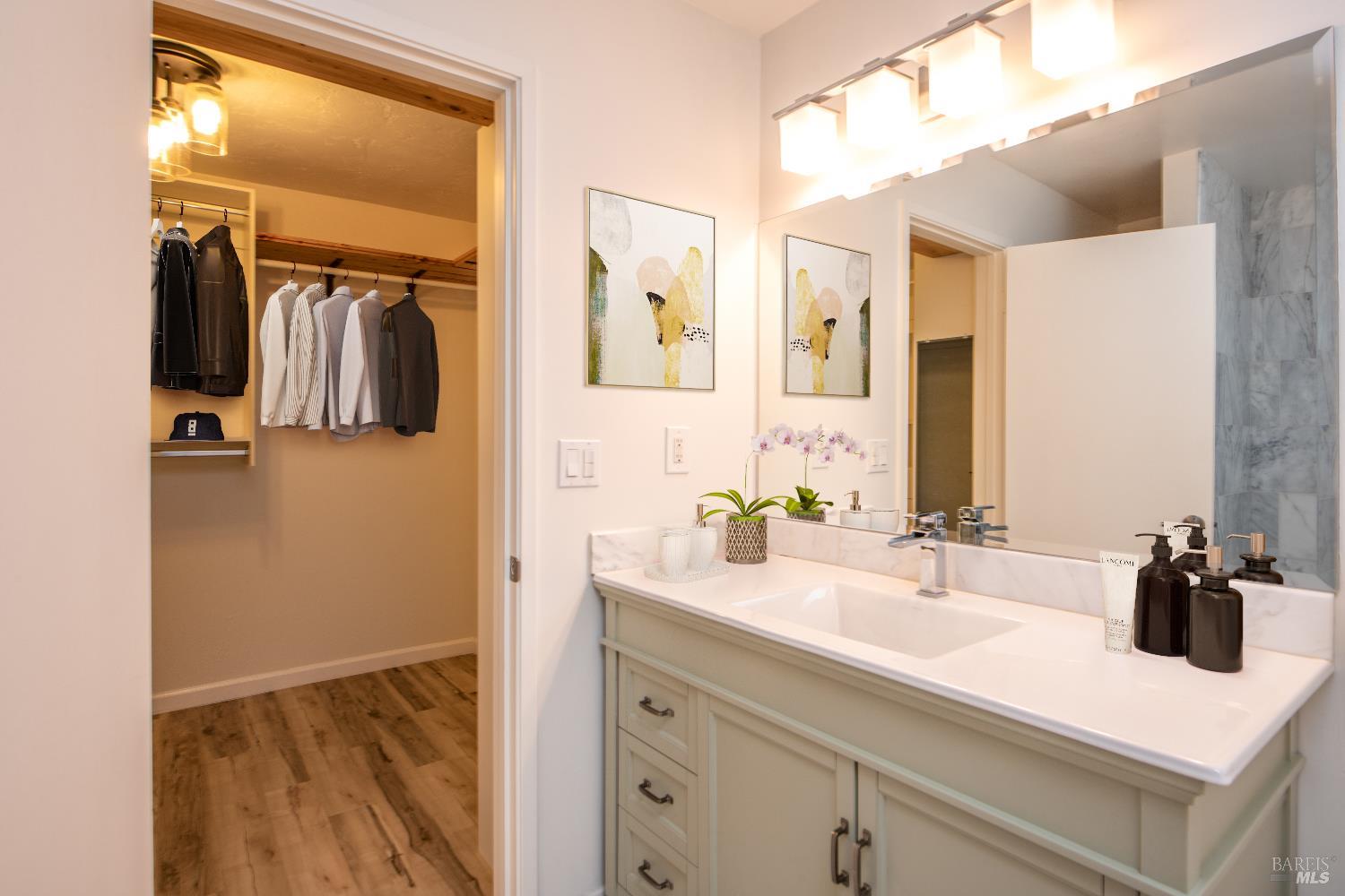 50 Vía Belardo, Unit 12 Greenbrae, CA 94904 - Photo 8 of 13 a bathroom with a sink and a mirror