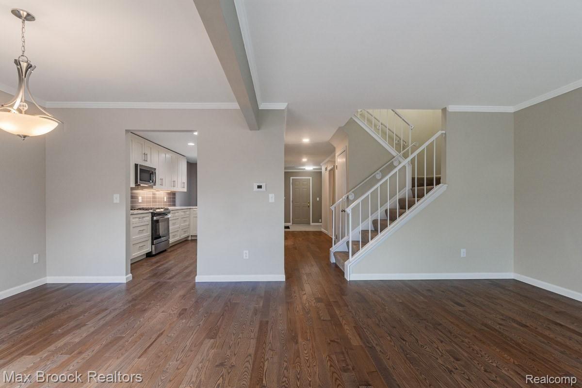1808 Thomas Court Rochester, MI 48309 - Photo 23 of 34 11.jpg View from Living room to dining room on left and to the kitchen and hallway to foyer and stairs to bedrooms