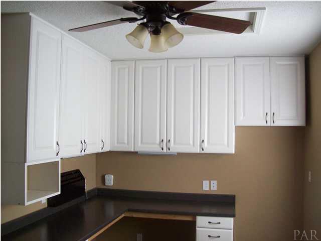 3521 Bauer Road Pensacola, FL 32506 - Photo 14 of 25 Office cabinets and desk area.