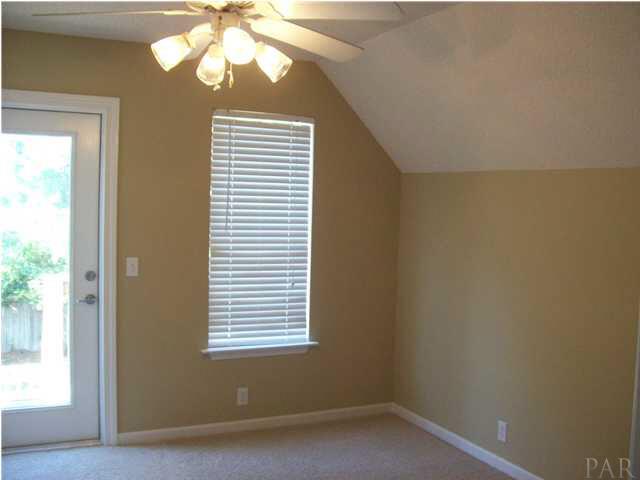3521 Bauer Road Pensacola, FL 32506 - Photo 17 of 25 Second upstairs bedroom with exterior door and deck area.