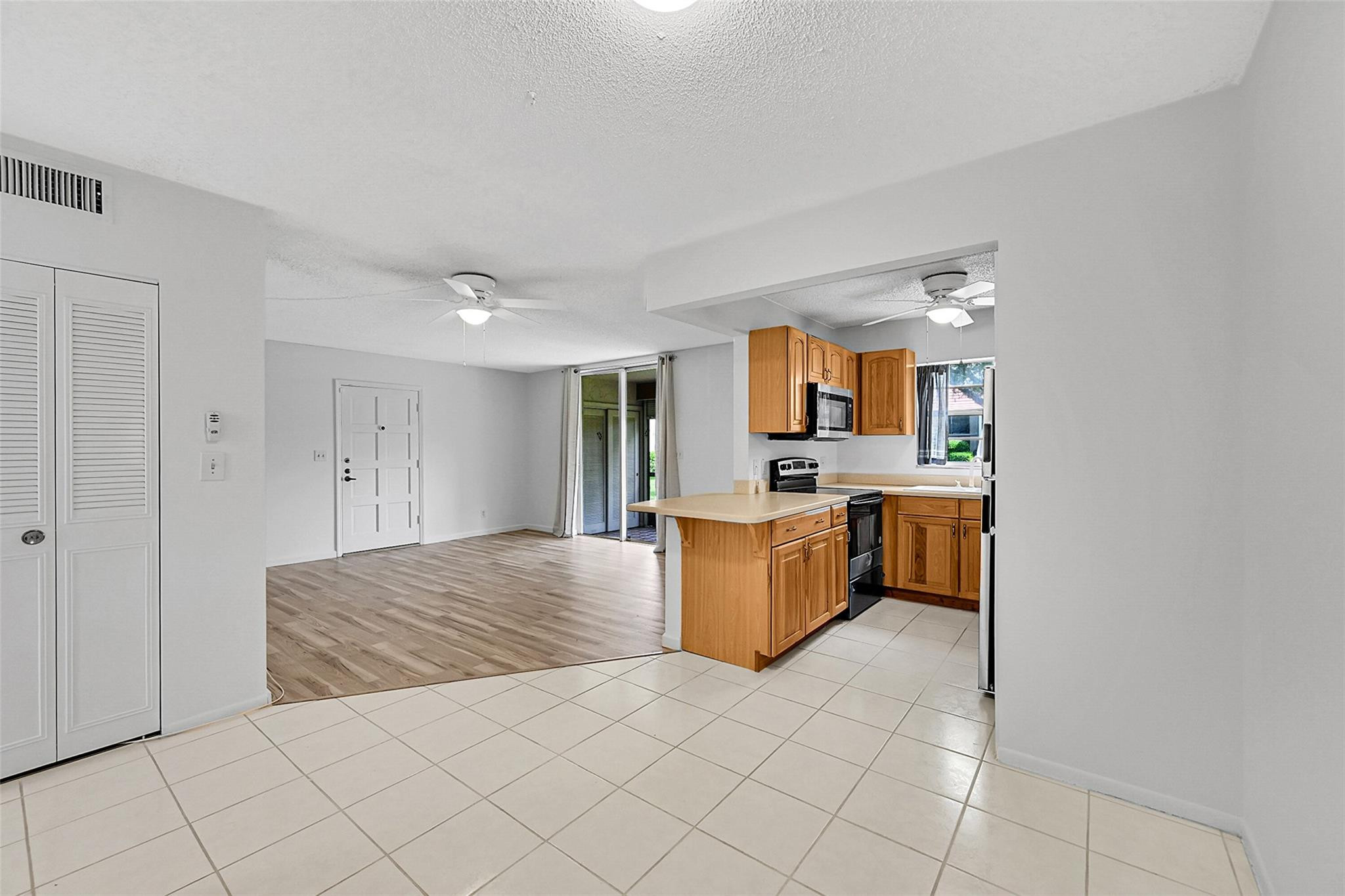 1024 Northwest 13th Street, Unit 149B Boca Raton, FL 33486 - Photo 11 of 42 a view of kitchen and living room