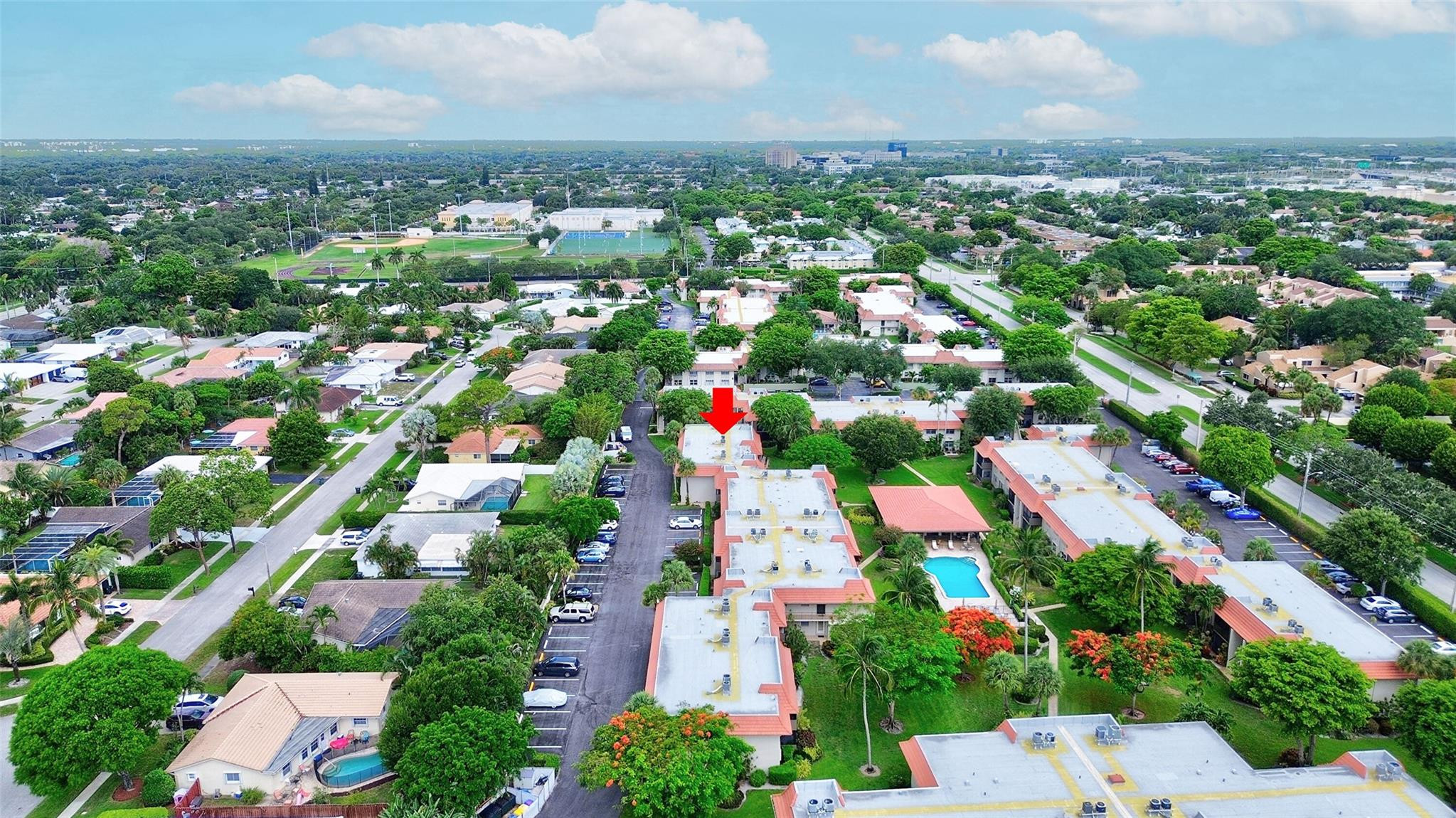 1024 Northwest 13th Street, Unit 149B Boca Raton, FL 33486 - Photo 42 of 42 an aerial view of residential houses with outdoor space and trees all around