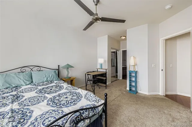 a bedroom with a bed and a table in it