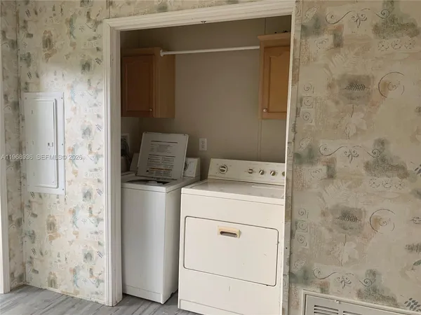 a utility room with dryer and washer