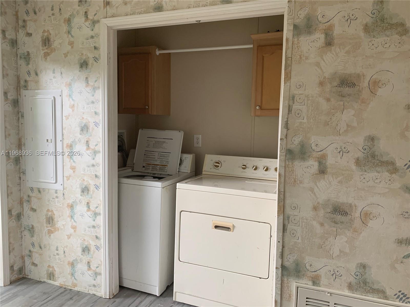 Watergate Boca Raton, FL 33428 - Photo 14 of 19 a utility room with dryer and washer