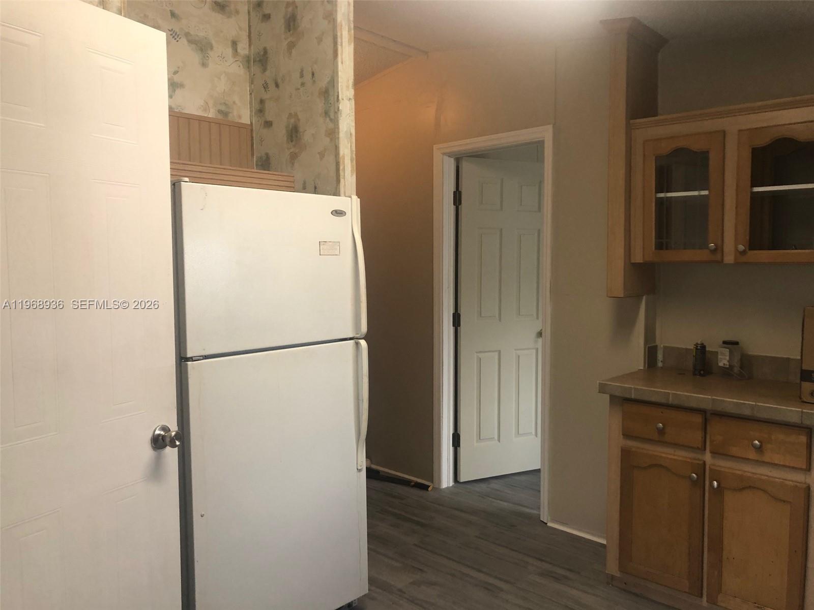 Watergate Boca Raton, FL 33428 - Photo 16 of 19 a white refrigerator freezer sitting inside of a kitchen