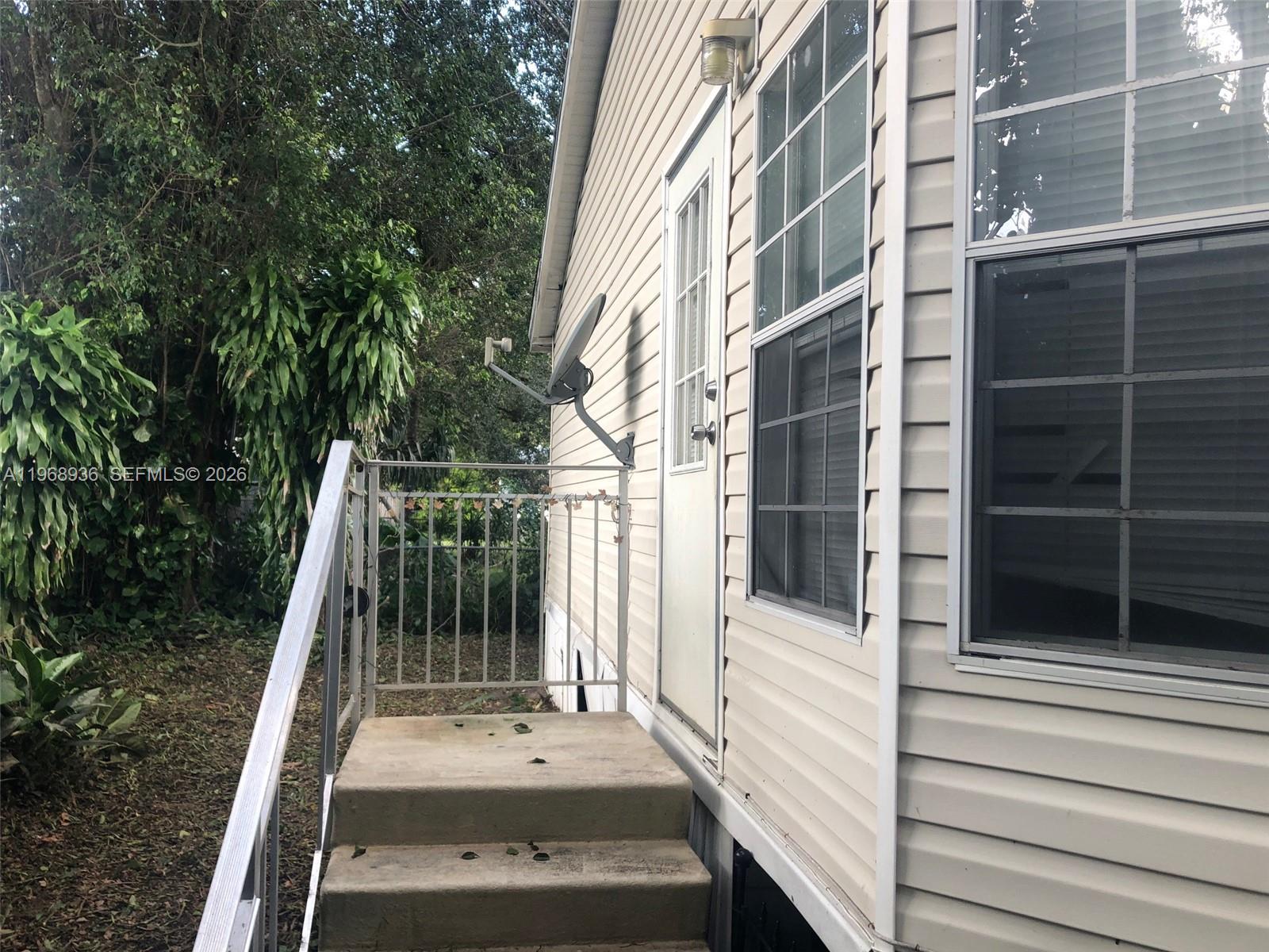 Watergate Boca Raton, FL 33428 - Photo 18 of 19 a view of a building with a door and stairs
